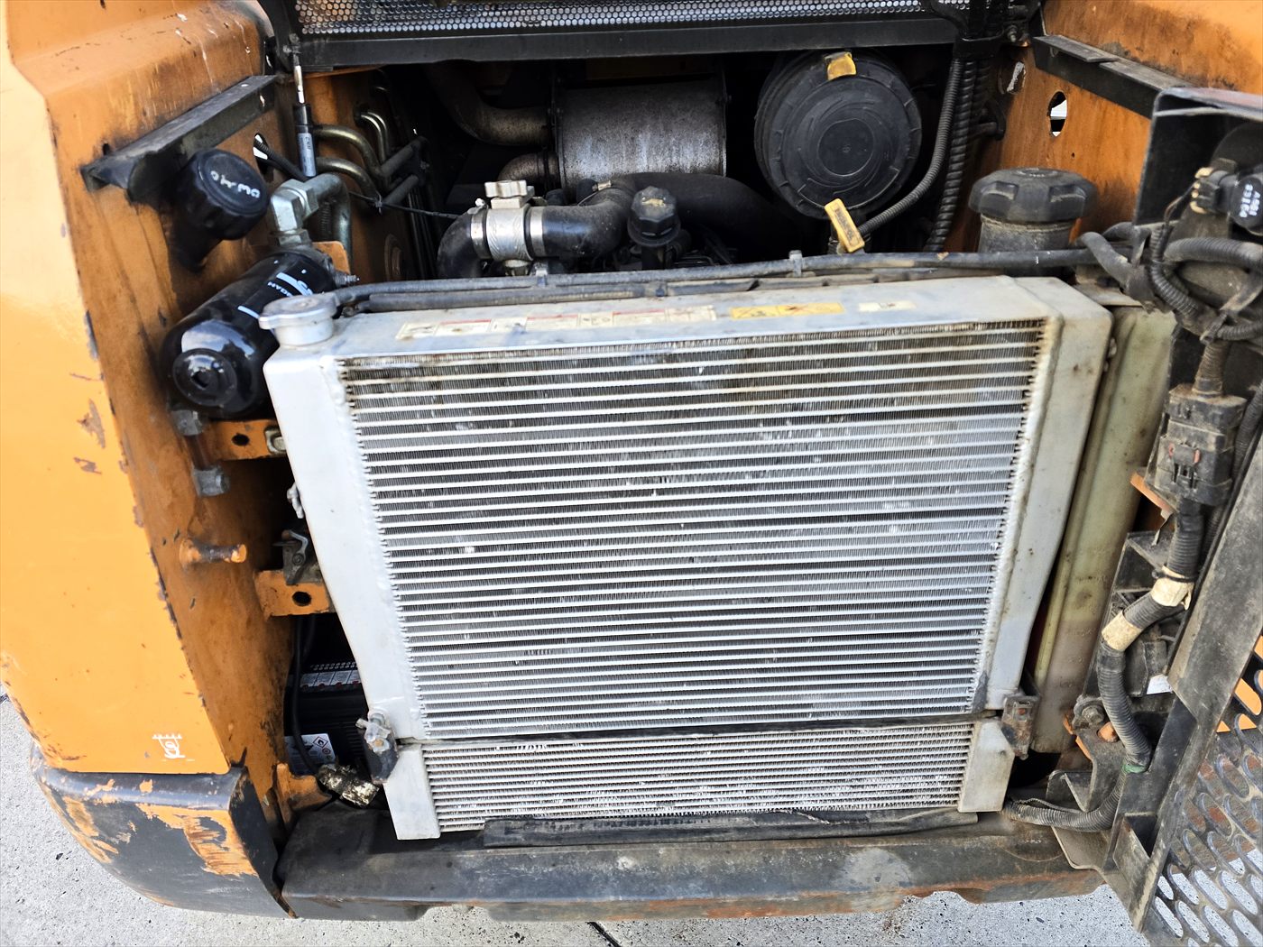 Skid steer opened up for preventive maintenance